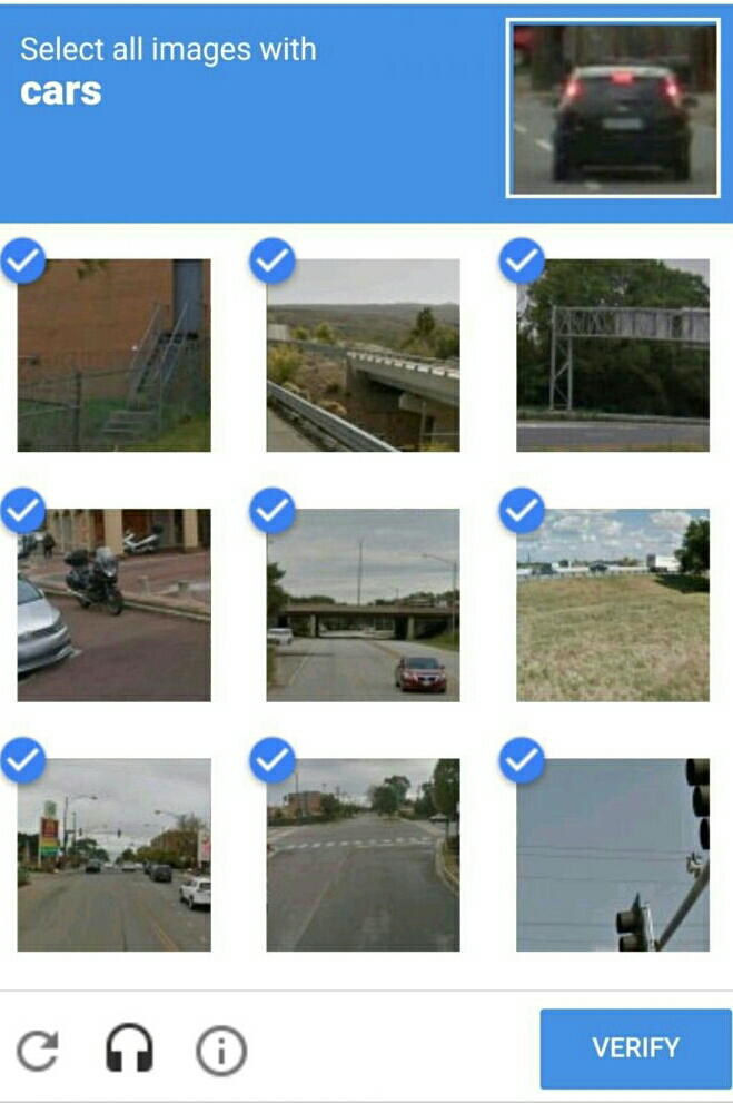 Screenshot of a captcha image of blurry cars with all boxes ticked 