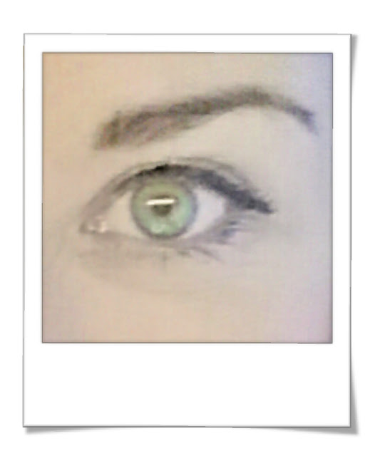 Close up photograph of my green eye