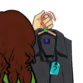 Woman holds up a hanger with a question mark on the labels 