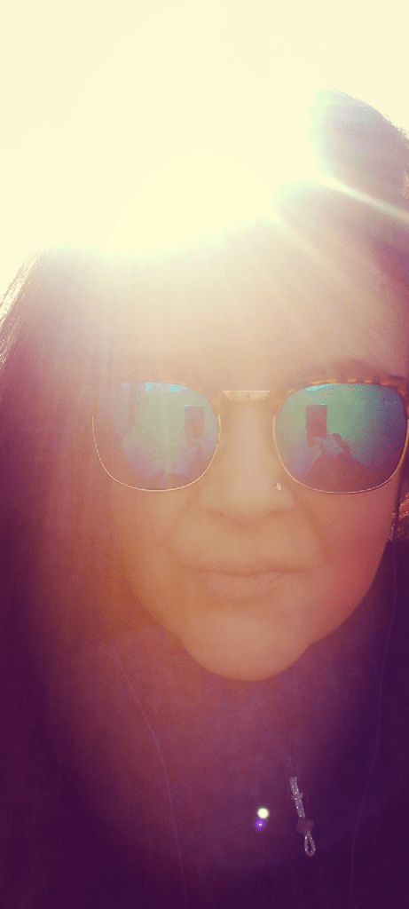 Me looking into camera with sunglasses on 