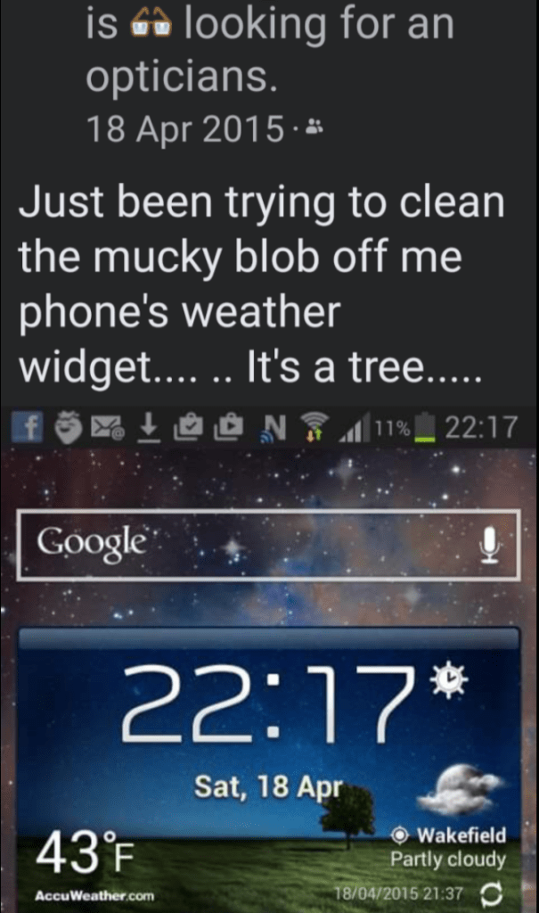 PICTURE DESCRIPTION Picture of screenshot of phone home page. Showing field scene with tree. With caption Just been trying to clean mucky blob off me phones weather widget. It’s a tree.